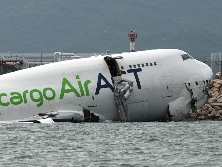 2 dead after cargo plane veers off runway at hong kong airport 68f58a561da6b